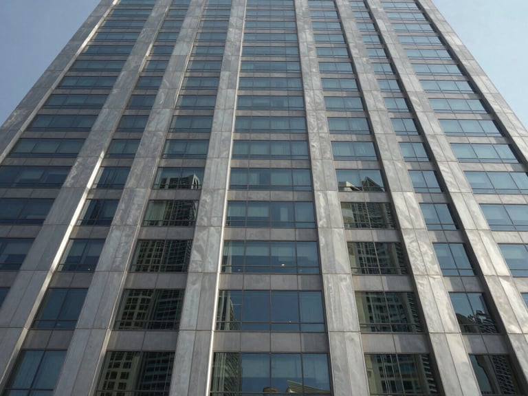 Low angle orthographic view of a modern Dubai commercial skyscraper facade, sharp glass panels reflecting direct desert daylight, clean structural lines, architectural steel gray tones.