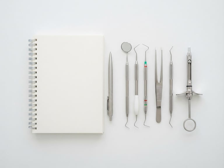 A minimalist flat-lay of modern dental tools and a clean notebook on a sterile white surface under high-key clinical daylight, 50mm lens