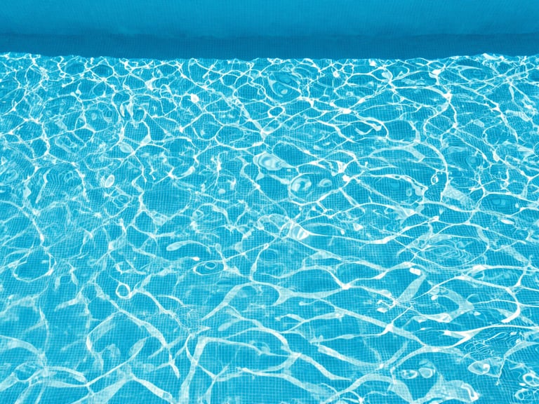 minimalist commercial photography of crystal clear pool water, bright midday sunlight, crisp royal blue and white tones, sharp architectural focus, 35mm