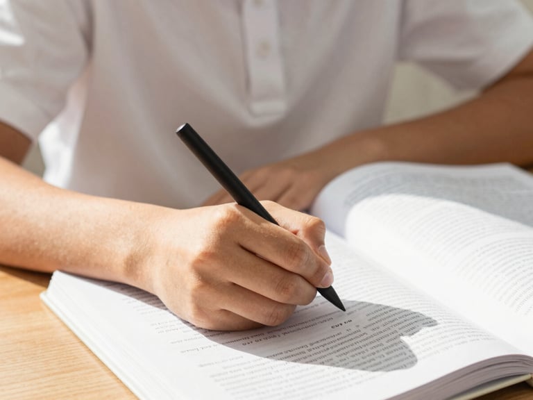 Close-up of a student's hands carefully writing notes in a textbook, bright natural light, focus on academic engagement.