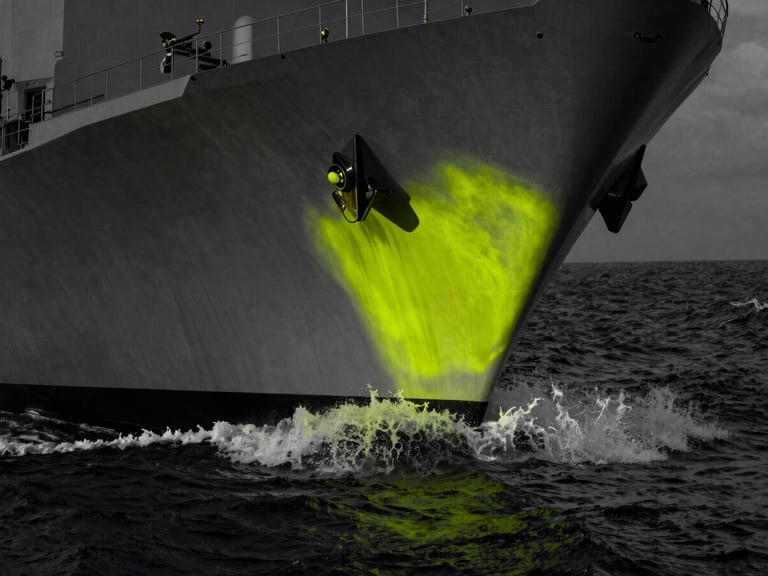 High-contrast industrial photography of a naval vessel hull cutting through dark ocean water, desaturated tones with sharp neon chartreuse highlights, dramatic low-key lighting