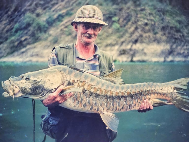 Legendary angler Christopher Oldmeadow holding a Golden Mahseer.
