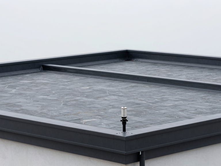 High-performance torch-on flat roofing system on a contemporary commercial building, clean lines