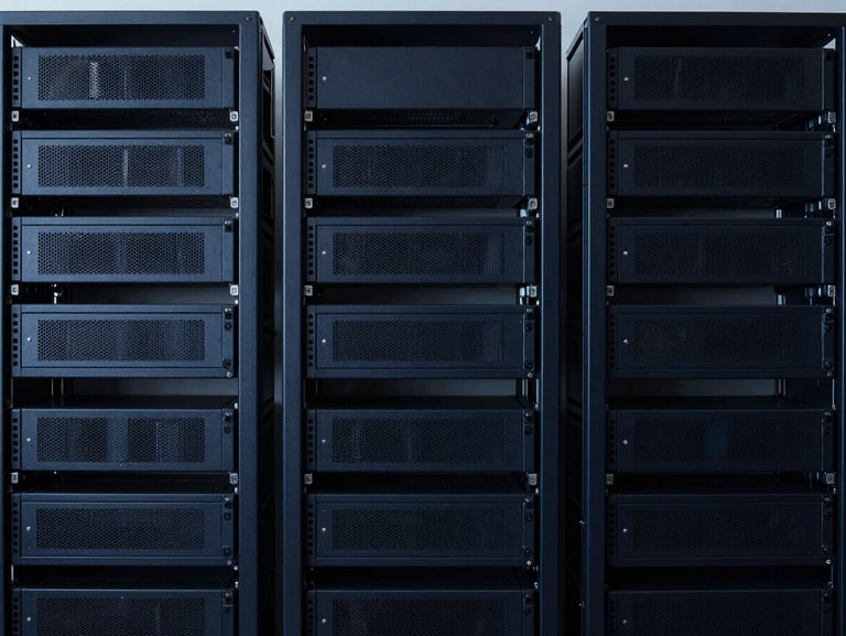 Minimalist workspace with structured server racks in background, cool lighting, sharp focus