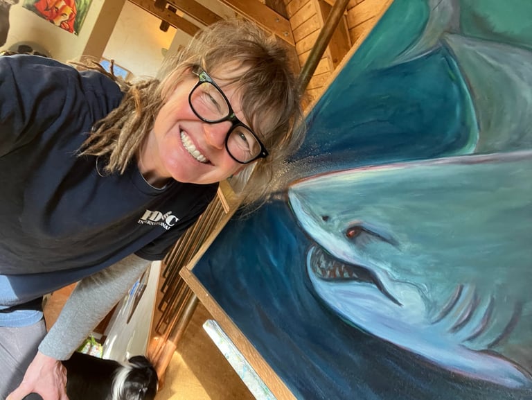artist with shark painting
