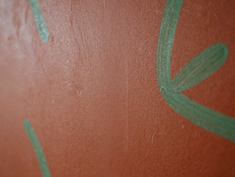 Abstract textured painting with deep terracotta and moss green brushstrokes, natural light, organic forms, 35mm photography