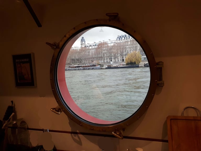 View of a river through a sidescuttle