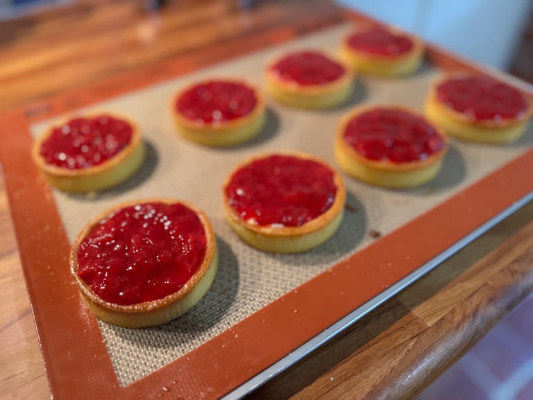 a baking tray with a tray of food and a cookie