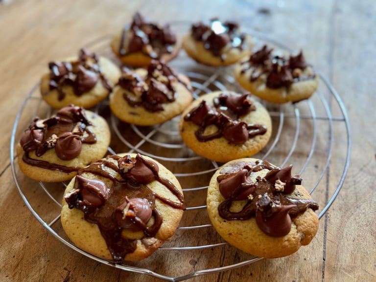 a bunch of cookies on a wire rack