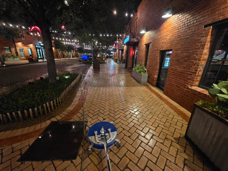in the middle of pressure washing outside of a restaurant