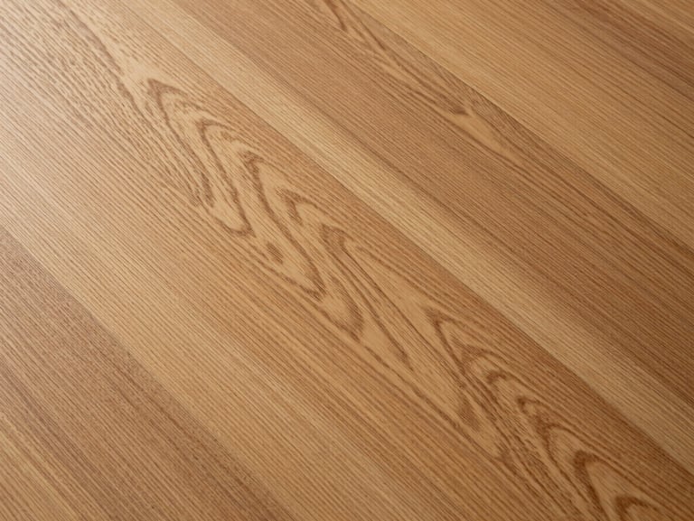Top-down detail of warm European oak SPC planks, showing realistic wood grain texture under soft diffused light.