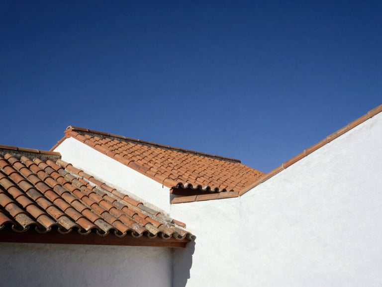 Oil painting of traditional terracotta roofs and clean geometric architectural lines of southern Spain under a deep indigo sky, styled in a bright modern interior.