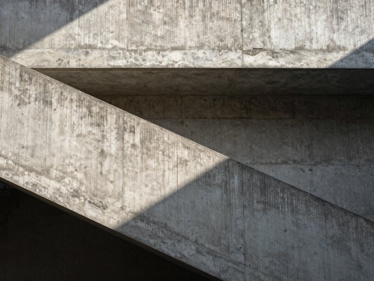 Flat-on architectural detail of a brutalist concrete staircase, sharp shadows, natural overhead skylight illuminating raw texture.