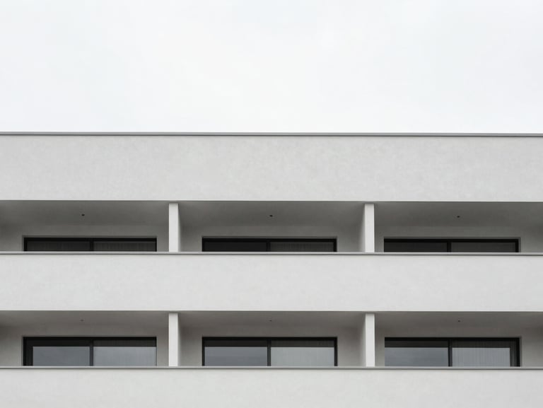 Minimalist modern apartment facade in Porto, clean lines, soft overcast daylight, desaturated tones