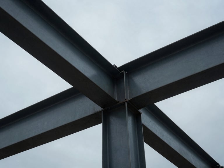 Abstract close-up of structural steel beams under a cool overcast sky, sharp architectural angles, deep shadows