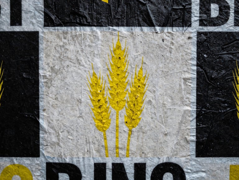 Close-up macro shot of wheat-pasted street posters on a textured concrete wall, high-contrast shadows, overcast daylight.