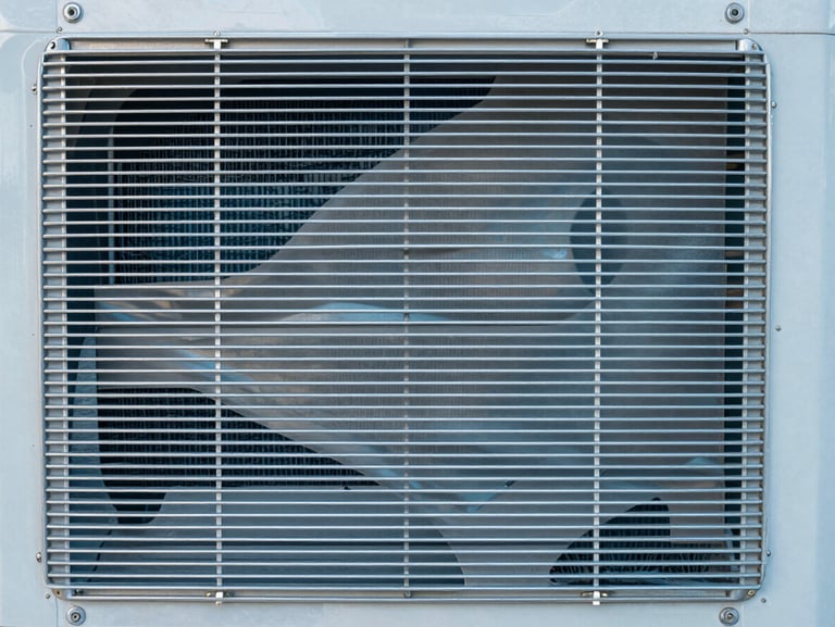Close-up of perfectly clean aluminum cooling fins on an air conditioner coil, shining metal, pristine and sanitized.