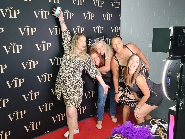 SweetAz Co photo booth setup at a real event in Brisbane, showing a clean, modern display and guests enjoying the experience.