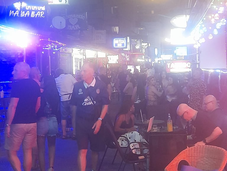 Thai ladies, customers and bars on Soi Bintabaht, Hua Hin in Thailand