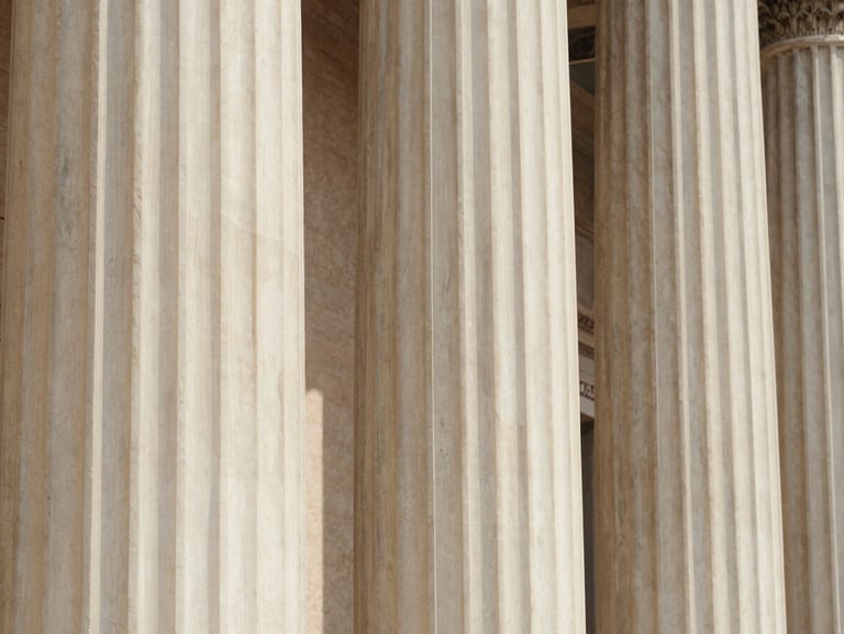 Sunlight hitting a marble column in Rome, clean architectural lines, warm European tones