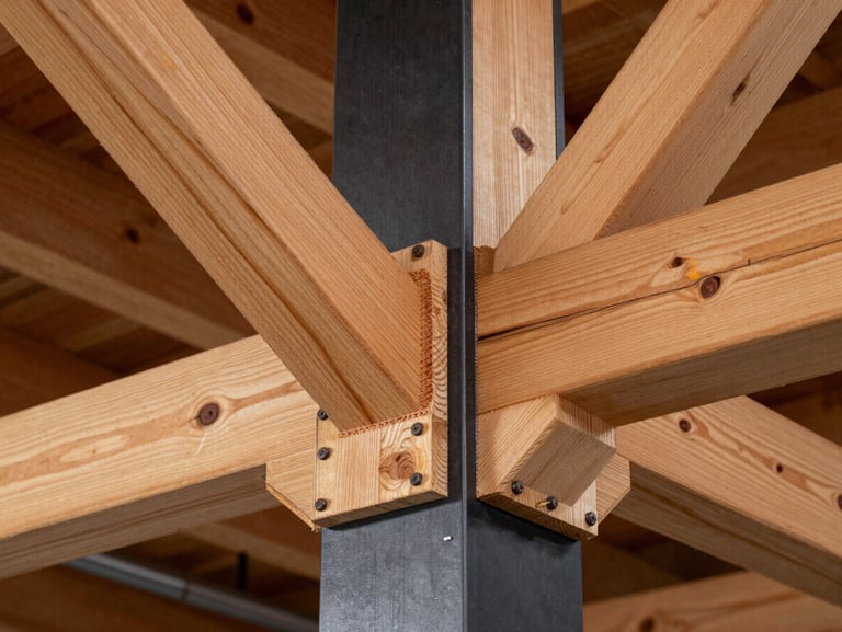 A close-up of heavy-duty steel-to-timber joinery, showcasing warm exposed cedar trusses bolted into a matte black steel column