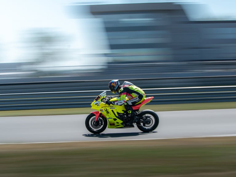 a person riding a motorcycle on a track