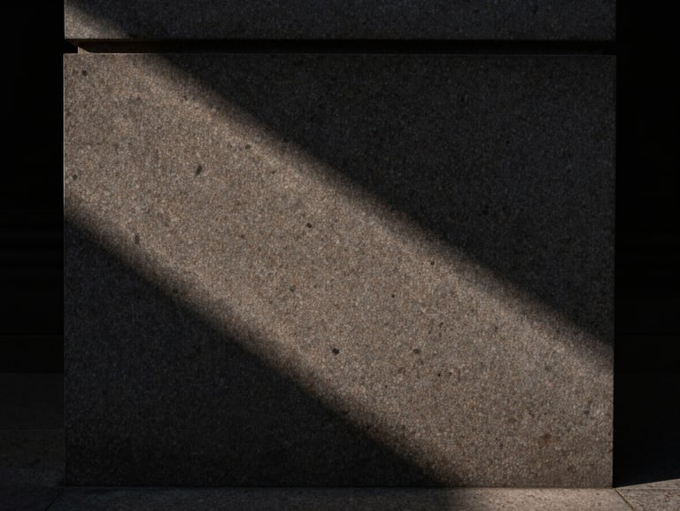 Straight-on architectural detail of honed Belgian bluestone meeting fumed oak, casting dramatic low-key shadows, moody natural side-light, Hasselblad photography.