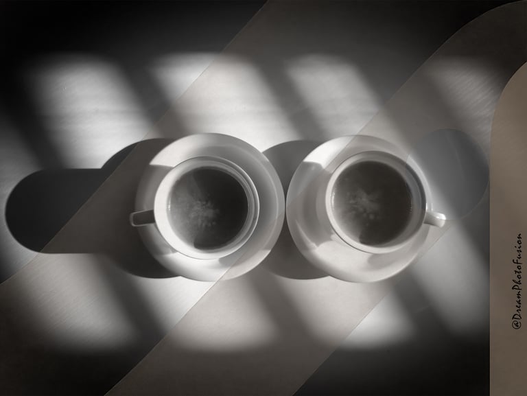 two cups of coffee in black and white