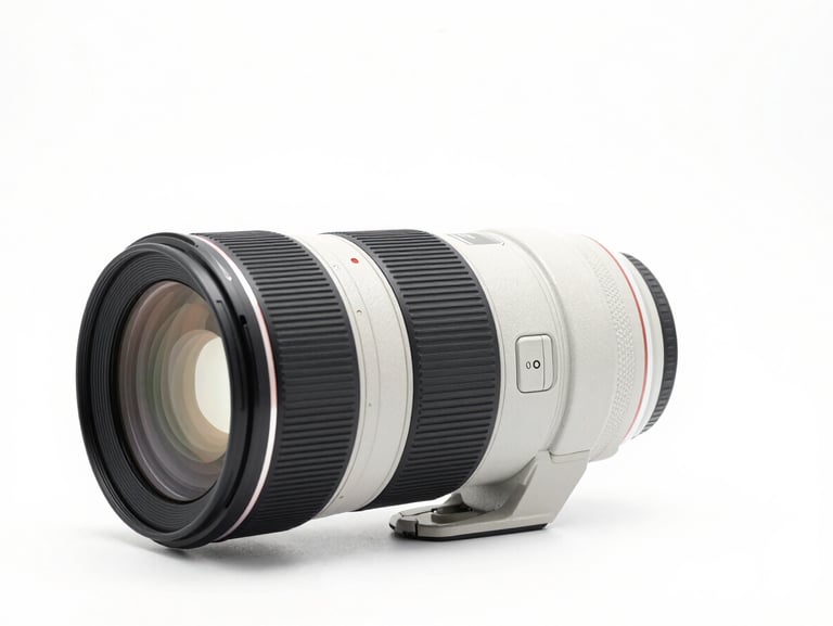 Professional 85mm f1.4 portrait prime lens, front glass element visible, clean white studio background, sharp details