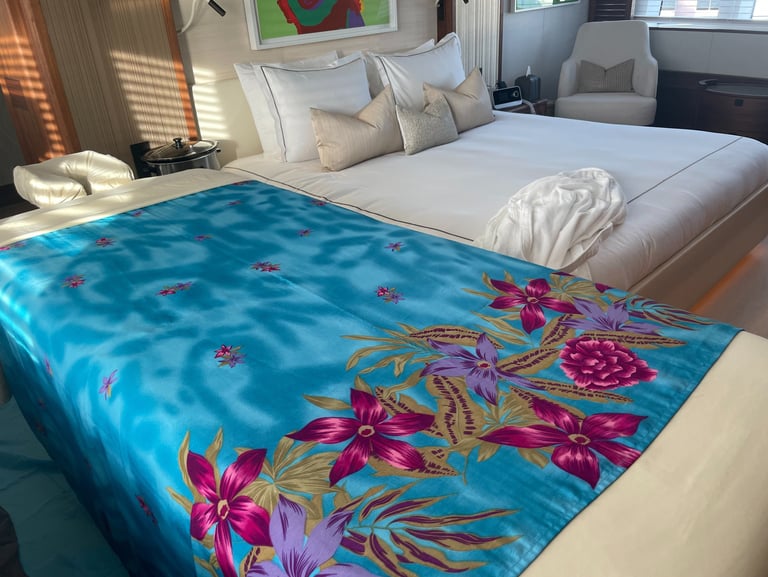 a massage table with a blue blanket in the bedroom on a yacht