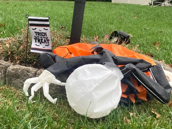 Deflated Halloween decoration needing repairs.