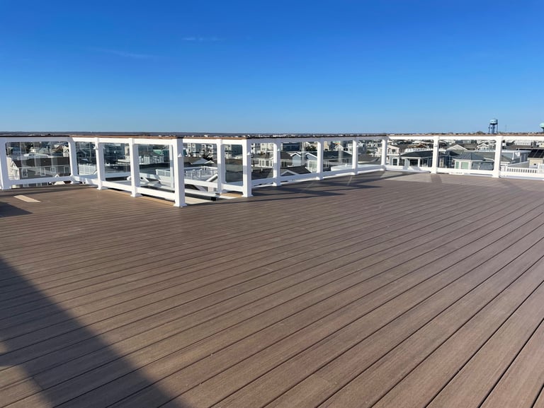 Custom framed floating rooftop decking over top of fiberglass.