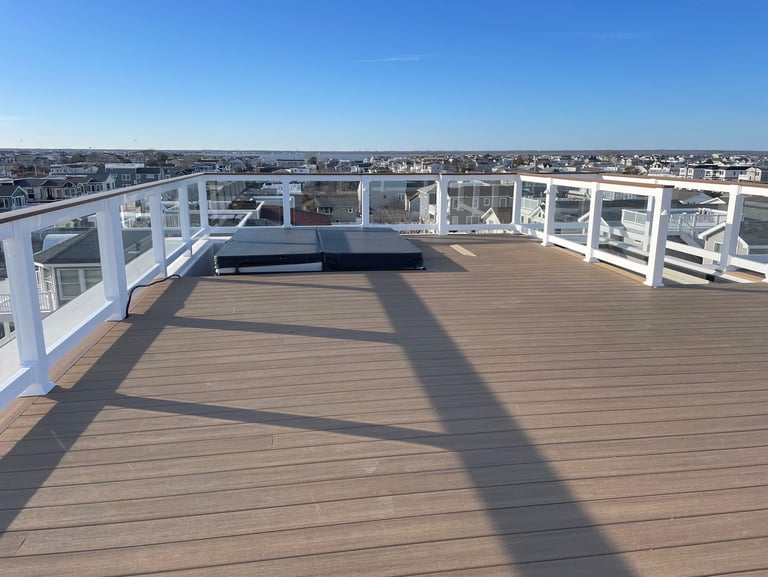Custom framed floating rooftop decking over top of fiberglass.