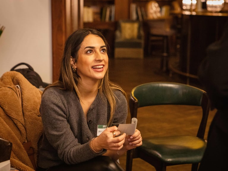 Young female professional looking supportive and smiling at workshop