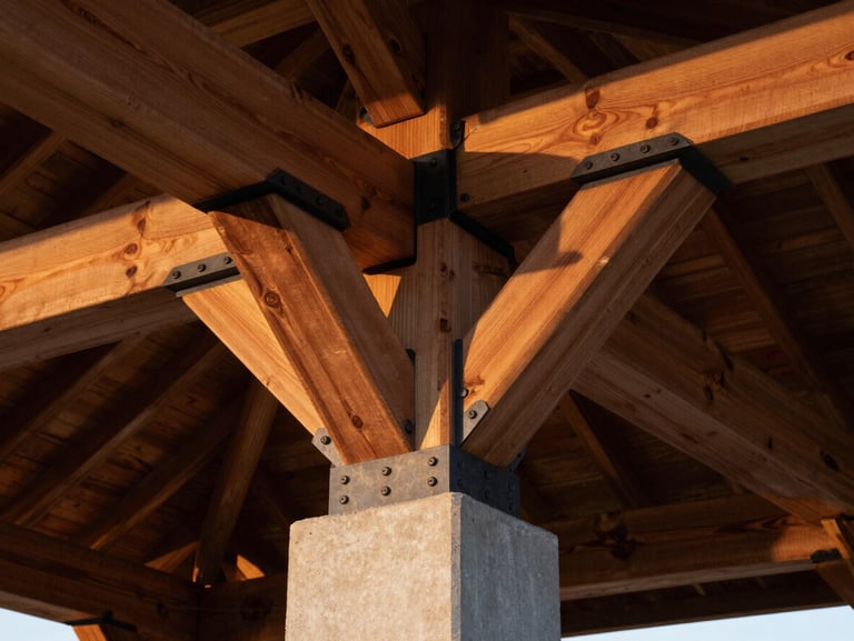 Low-angle architectural detail of heavy timber pavilion joinery, black steel structural connector plates, warm twilight glow on cedar wood, sharp poured concrete base below.