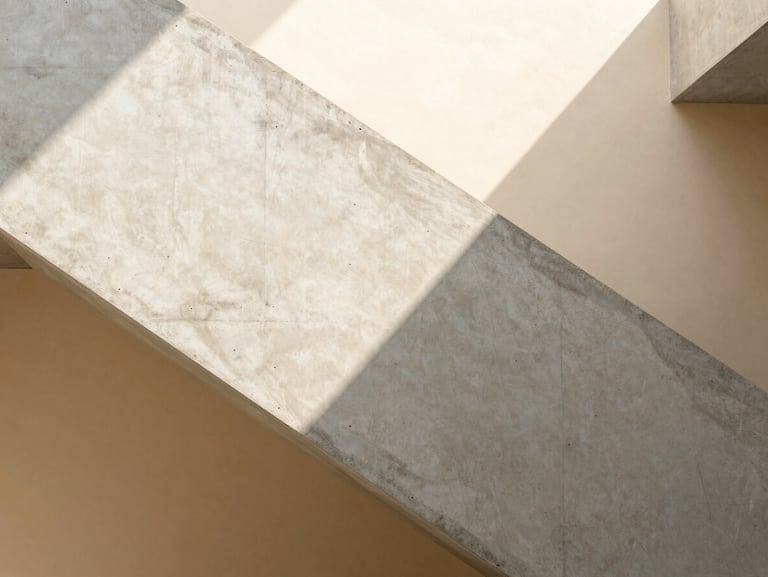 Architectural detail shot of a modern concrete and oak staircase, geometric sunlight casting sharp shadows on a warm beige wall