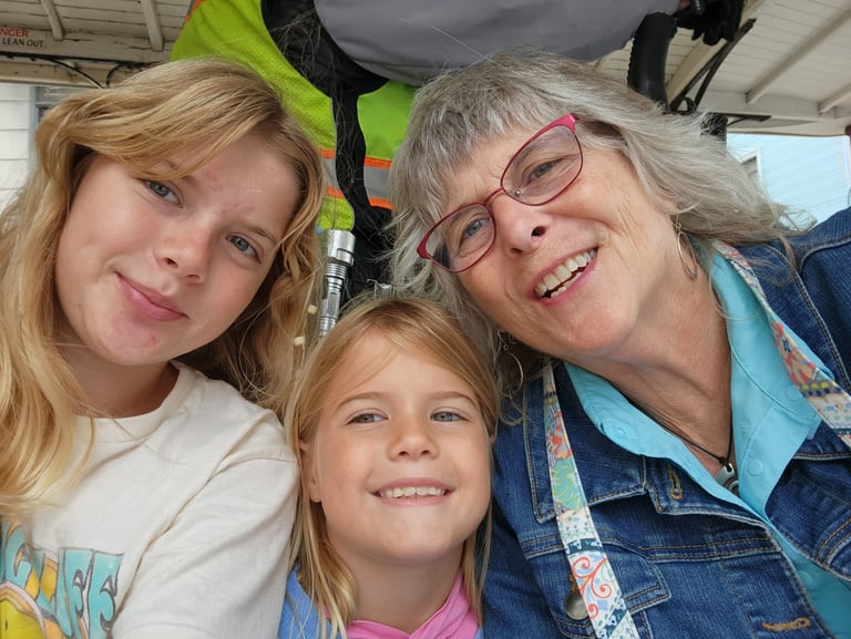 Mary Grace, Teresa Wood-Hansen, and Cecelia smiling