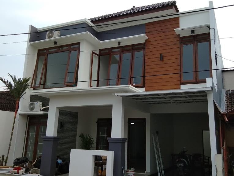 rumah dengan fasad minimalis permainan grc woodplank dan topi-topi beton