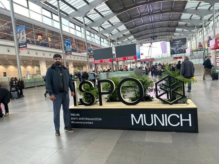 a man standing in front of a sign that says spot spot