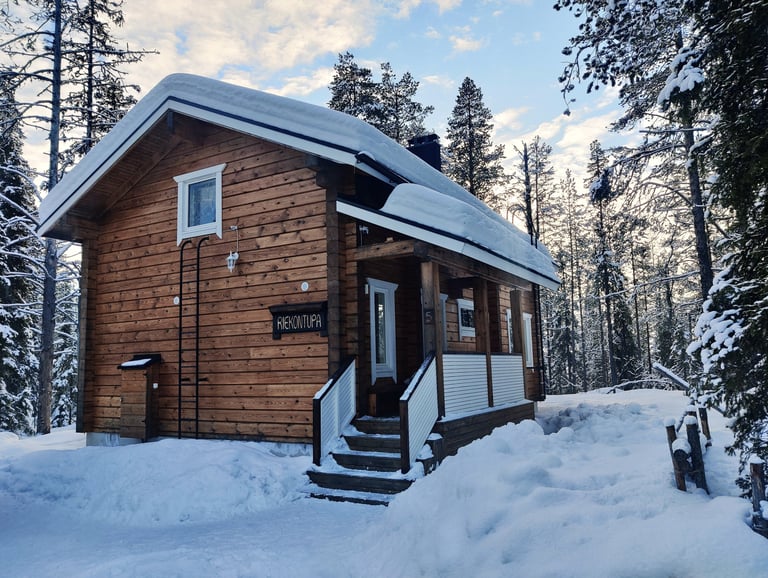 Rustic finnish log cabin in a snowy winter landscape, riekontupa cabin located in Kittilä lapland