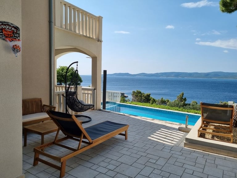 Hanging chair and wooden dining set with pool and sea view, Lokva Rogoznica