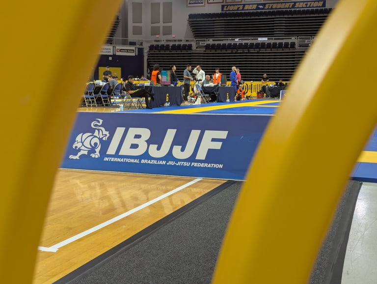 BJJ competition venue with IBJJF branding, capturing a martial arts tournament enviroment
