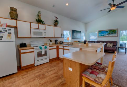 a kitchen with a refrigerator, stove, and microwave in Florida Villa