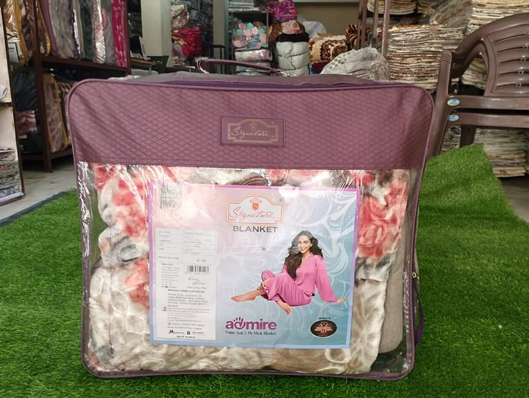 "Signature branded blanket, high-quality fabric design for premium retail and hotel supply."