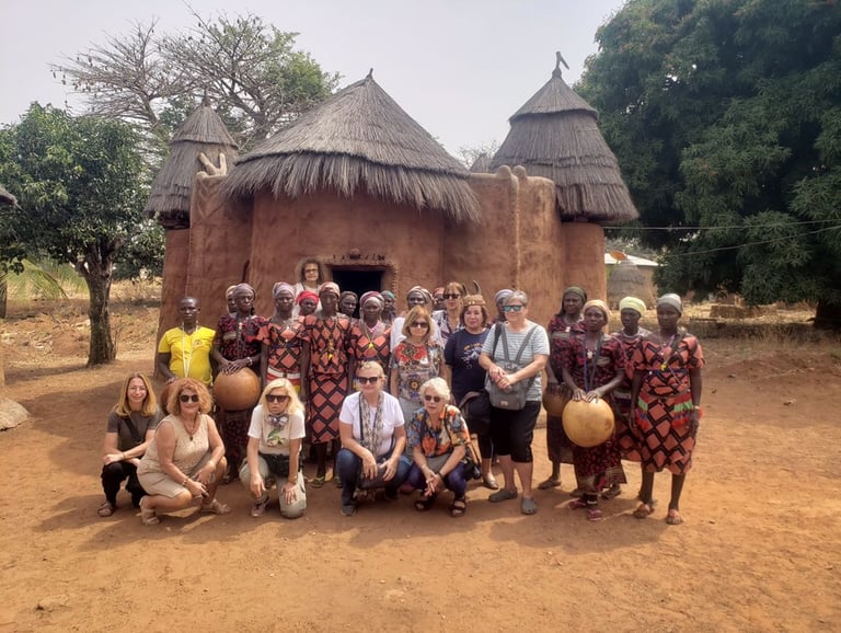 A group of Tourists visiting Tata Somba Village during a Multi-country Trips of Benin, Togo & Ghana