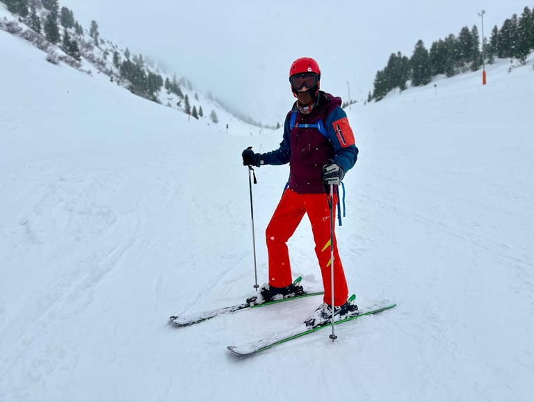 a guy skiing in alps mountains in austria