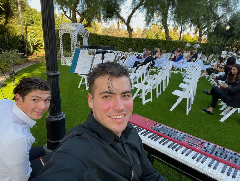 Pianist Daine Jordan and violinist Jude Dzama getting ready for a wedding gig