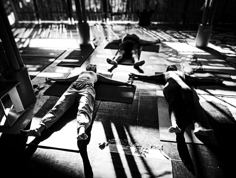 Yoga practitioner lie in a relaxtion pose after practise.