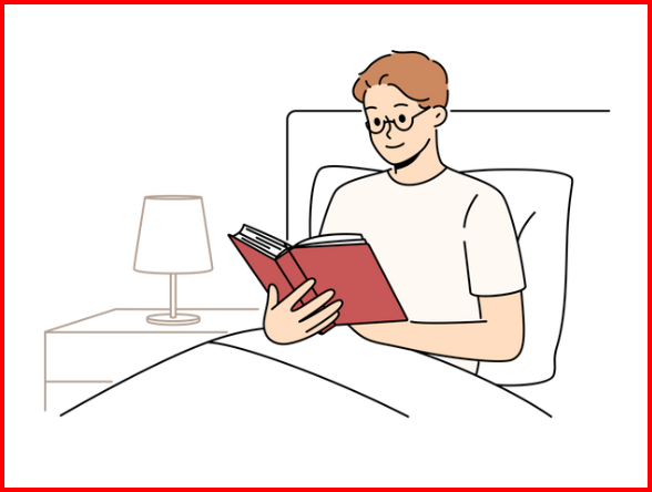 a man reading a book in bed with a lamp on the side