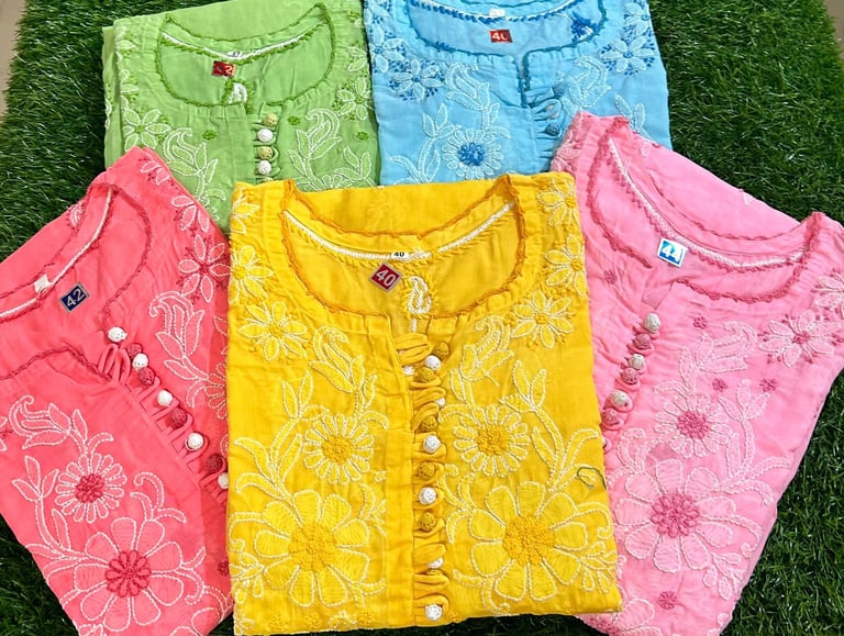 Handcrafted Chikankari cotton kurtis in vibrant summer colors with intricate white floral embroidery.